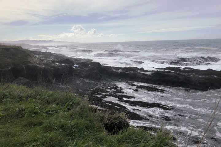 View of ocean and rocks with nice sky