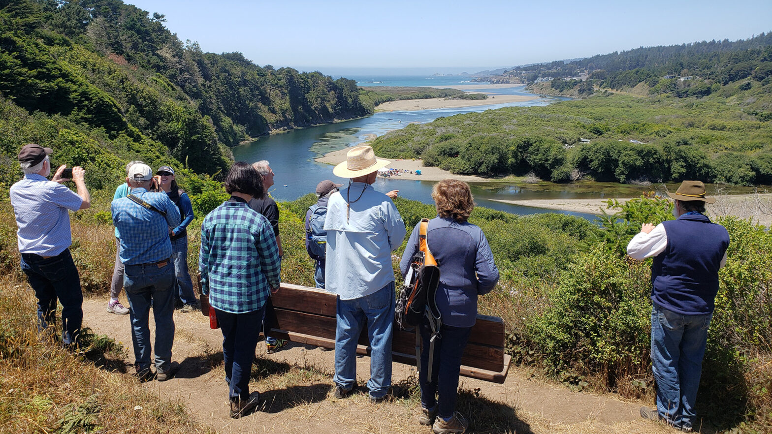 People looking out to a river