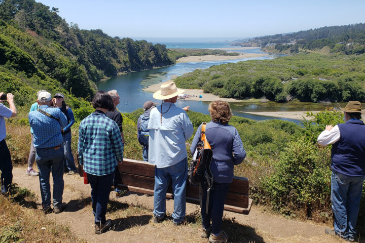 People looking out to a river