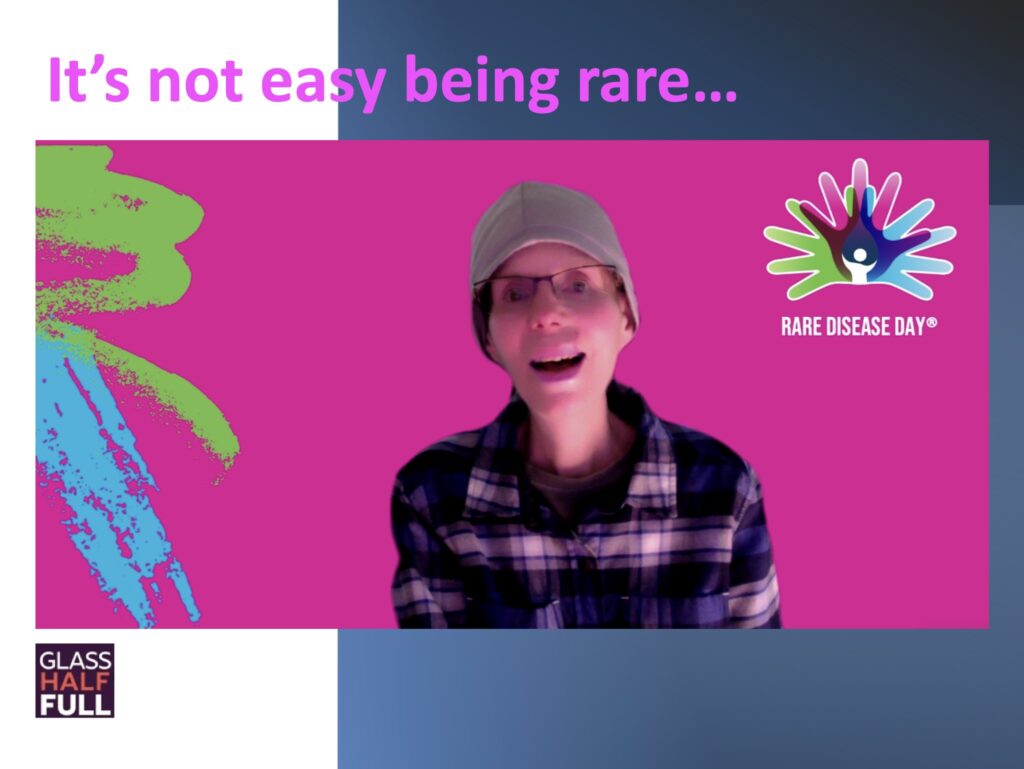 Leslie poses on a background that says "It's not easy being rare"